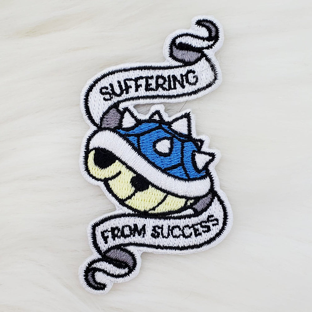 Suffering from Success Iron-On Patch